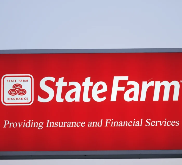 Illuminated State Farm Insurance sign with copy space