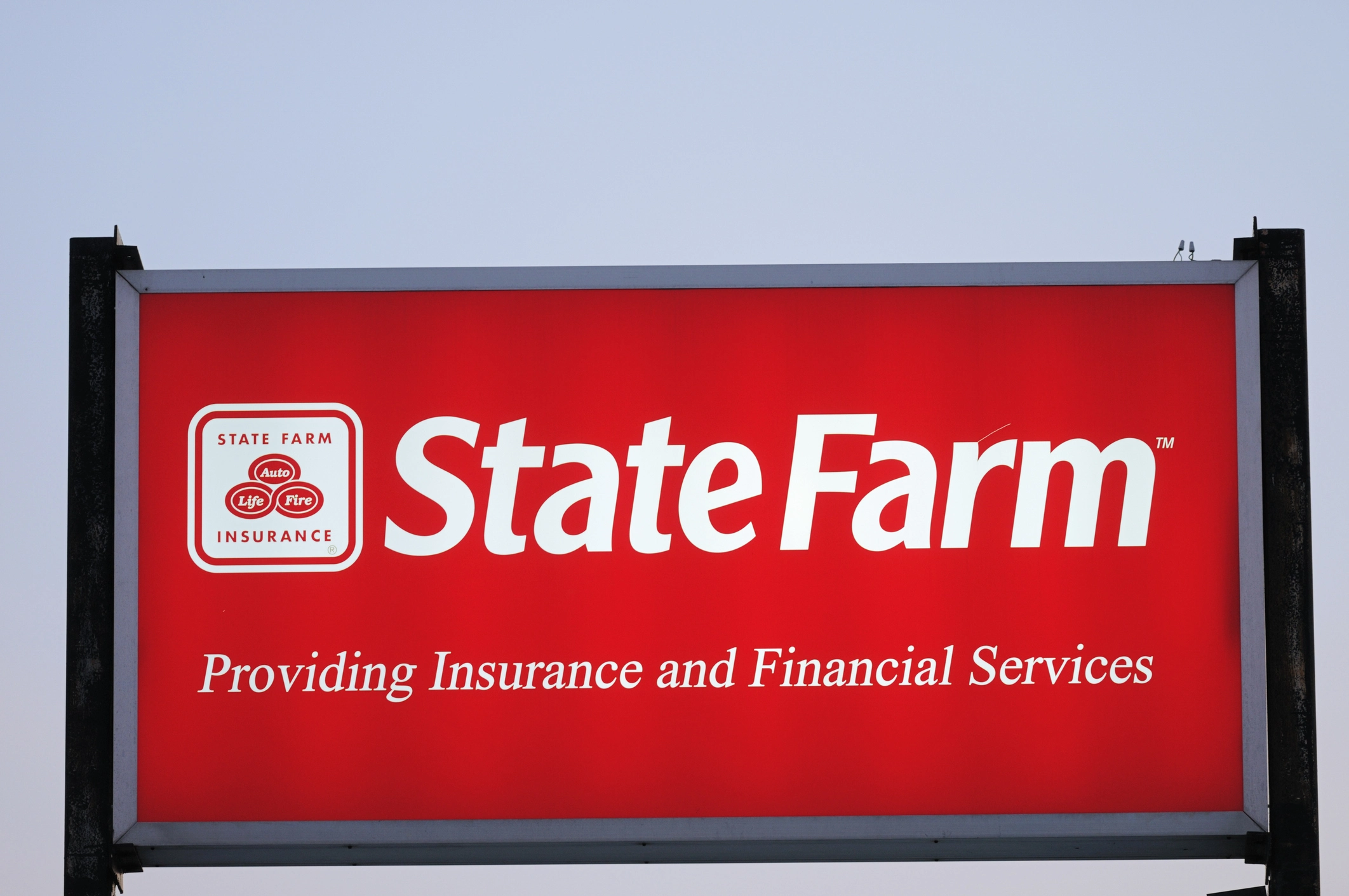 Illuminated State Farm Insurance sign with copy space